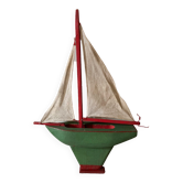 Pretty wooden basin sailboat with beautiful vintage colors. Old toy from the 1940s-50s