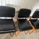 Set of 4 vintage 1960s chairs in wood and black faux leather – design