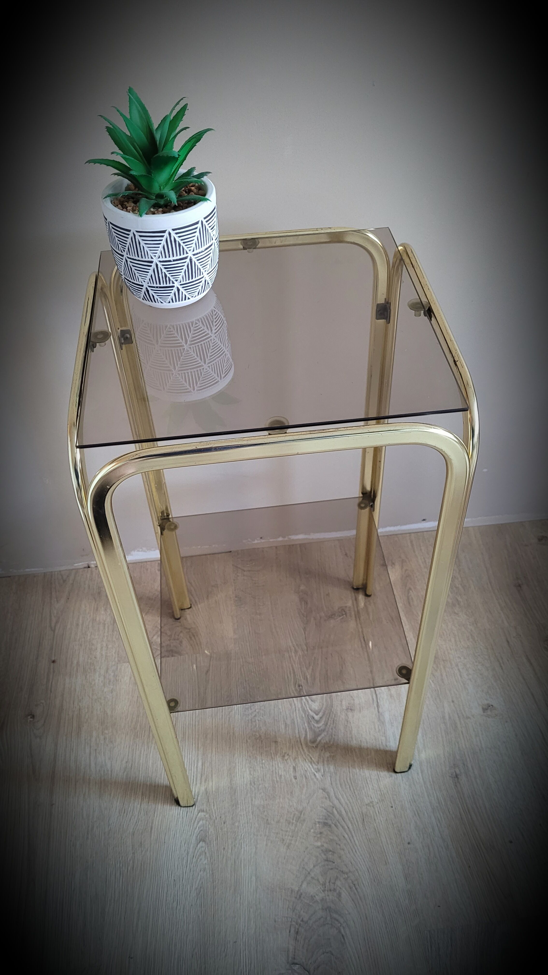 Golden side table and smoked glass