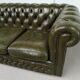 Three-seater green leather Chesterfield sofa