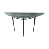 Half-moon console with glass top resting on three tapered legs in black lacquered metal ARTELANO