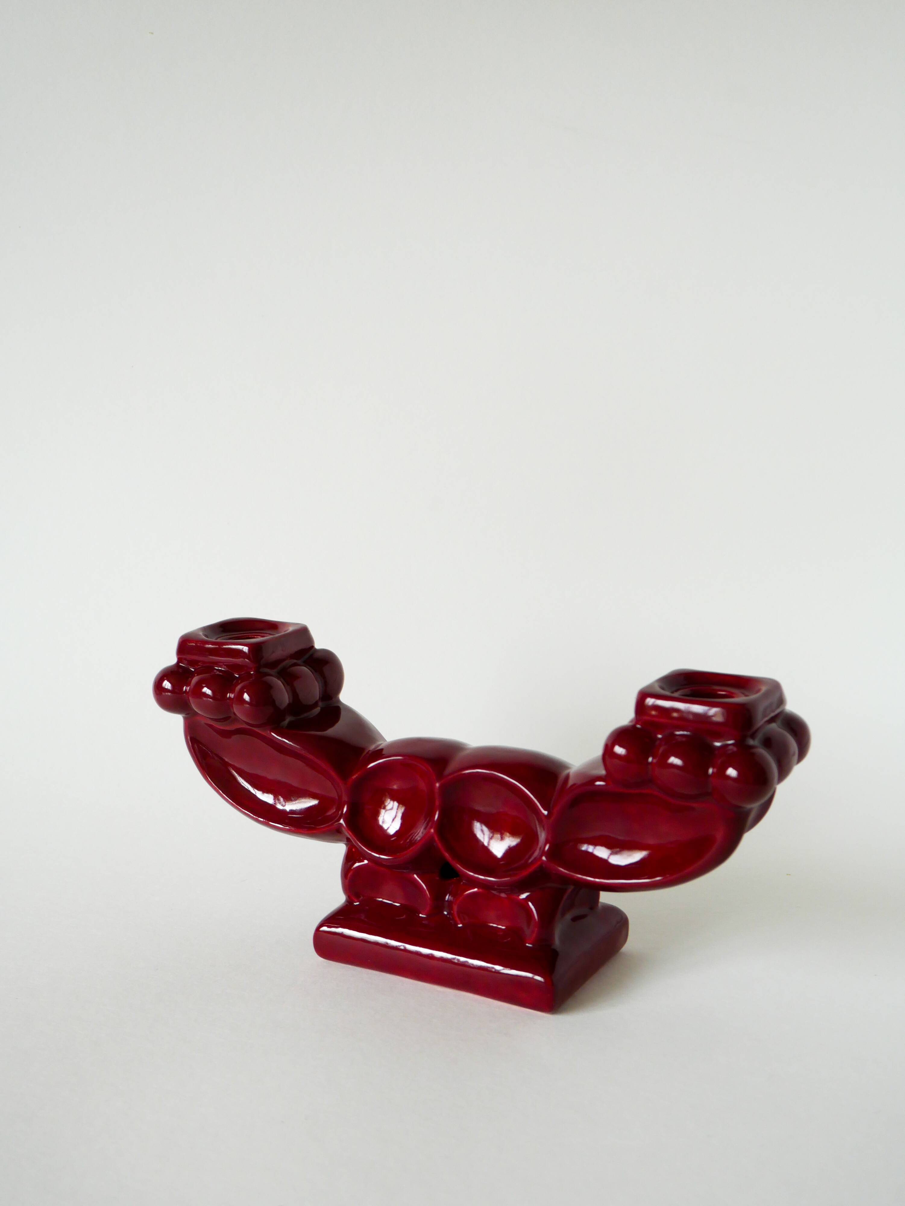 Pair of large burgundy ceramic candlesticks, 1950