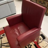 RED LEATHER ARMCHAIRS signed “SEDE”