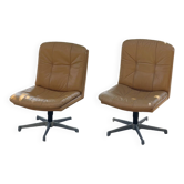 Pair of vintage ochre leather swivel armchairs, 1970s