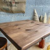 Bistro table with central cast iron leg and rustic top