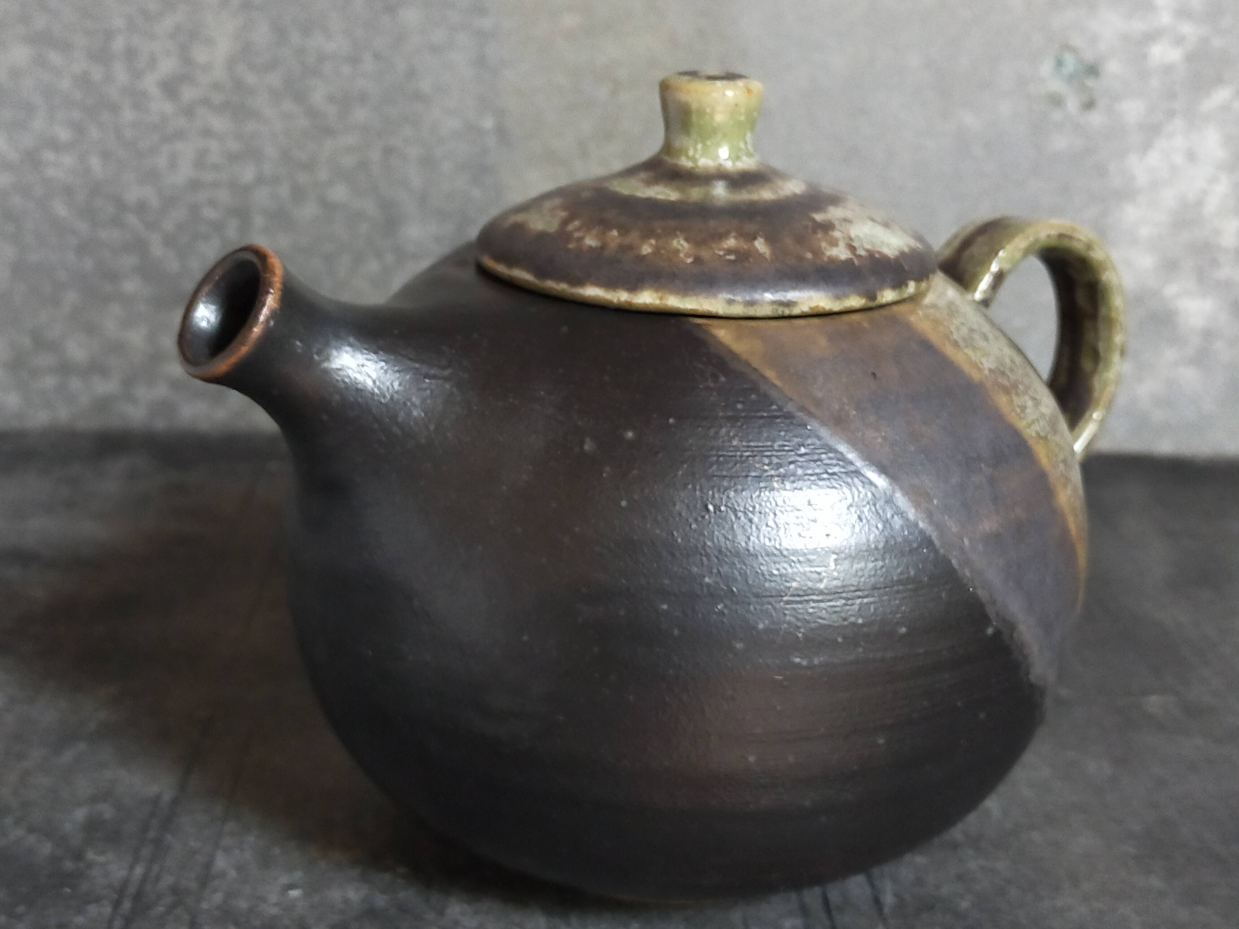Vintage enameled stoneware potter's teapot