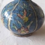 A very original antique vase with a floral design.