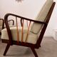 Set 2 old designer fireside chairs from the 50s wood and vintage fabric