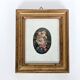 Vintage floral print with oval mat and gold wooden frame.