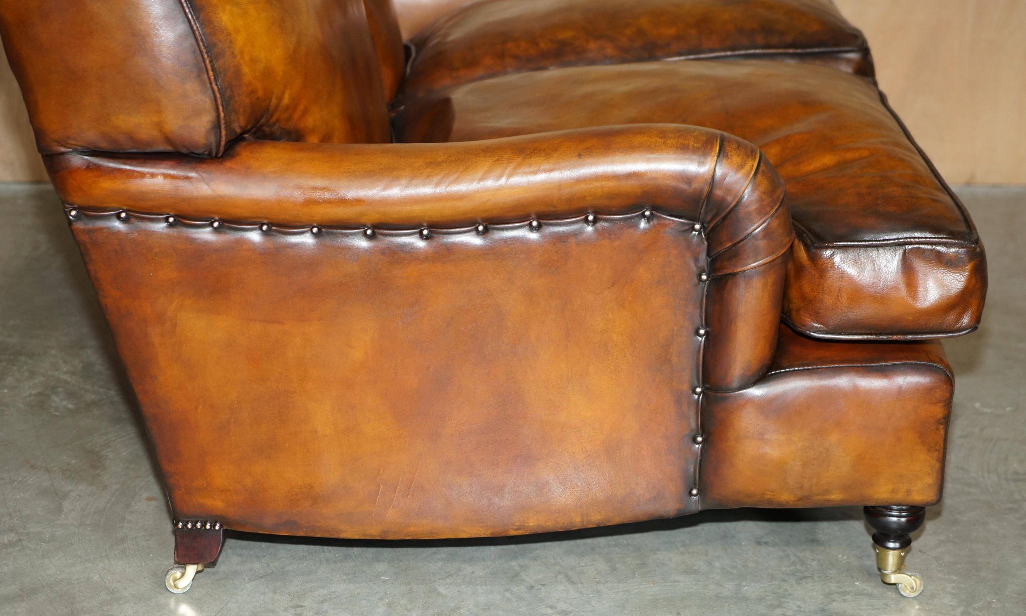 Howard & Son restored leather canapé, width 145 cm