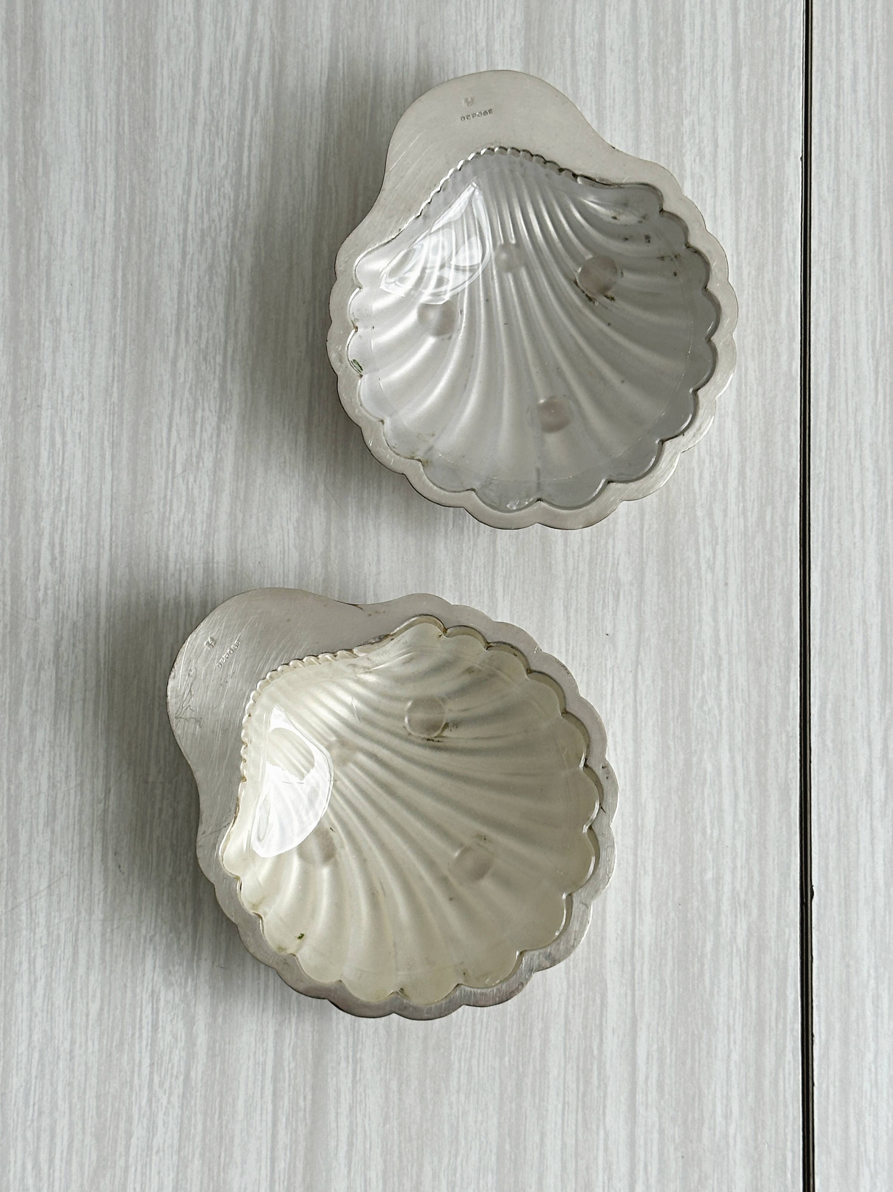 Pair of silver shell bowls