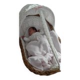 Vintage 1970s wicker cradle on wheels