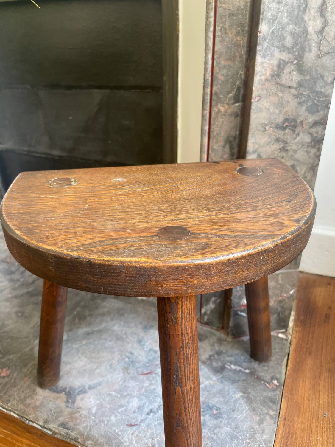 Dark wood tripod stool