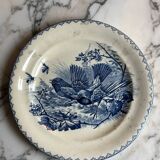 Plat rond en terre de fer à décor d'oiseaux