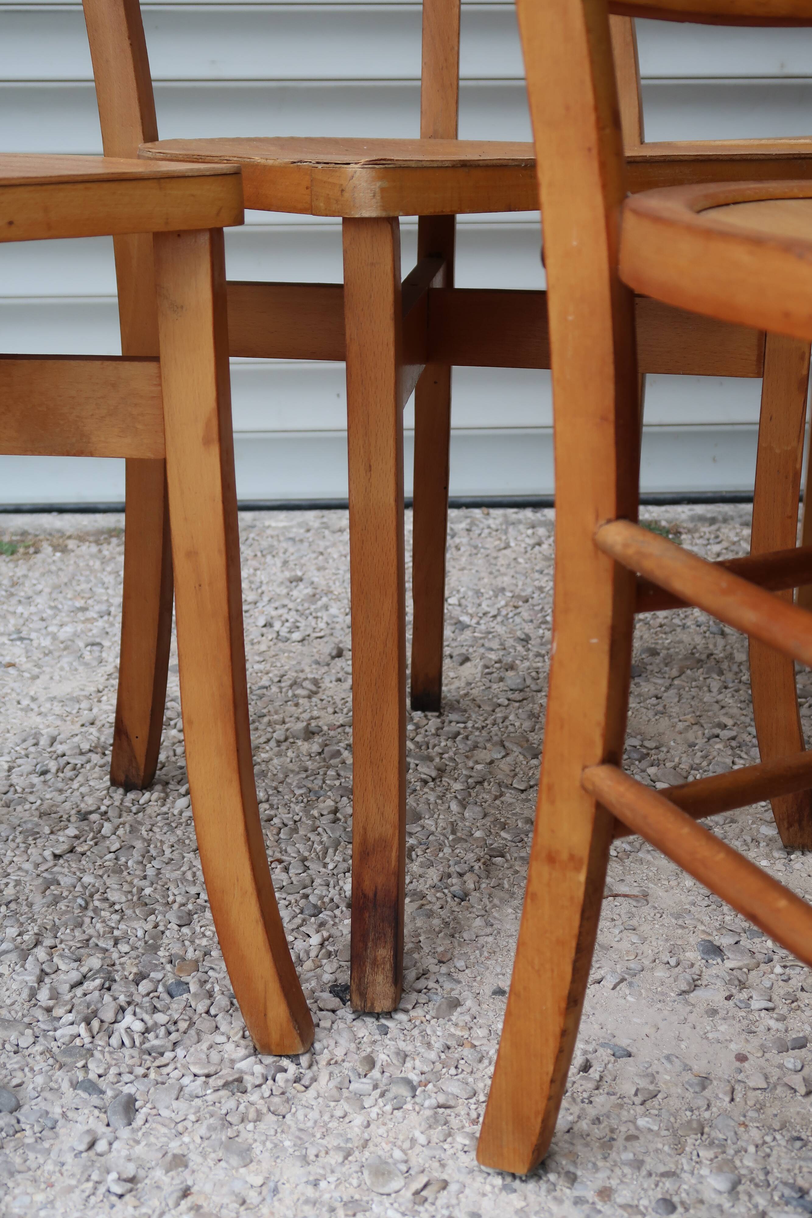 Set of 7 mismatched bistro chairs