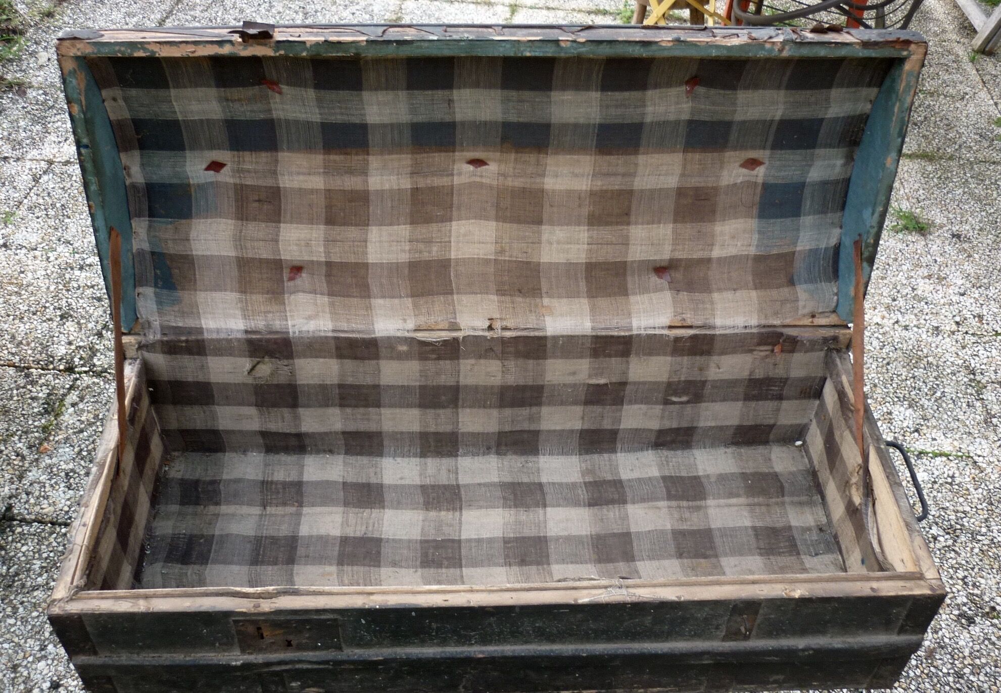 Old bulging wooden travel trunk