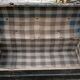 Old bulging wooden travel trunk