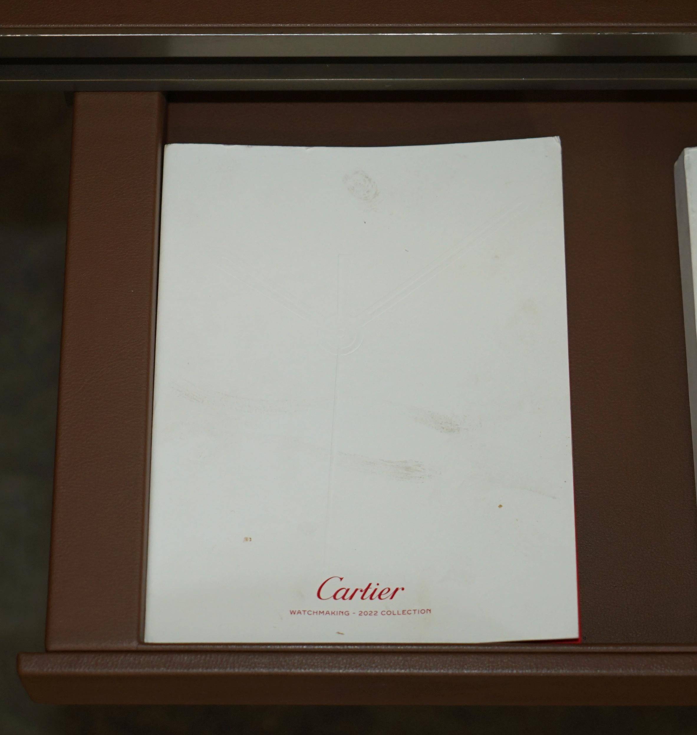 Modern mid-century writing desk signed Cartier in bronze and leather.