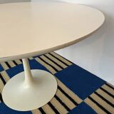 White dining table with tulip base by Maurice Burke