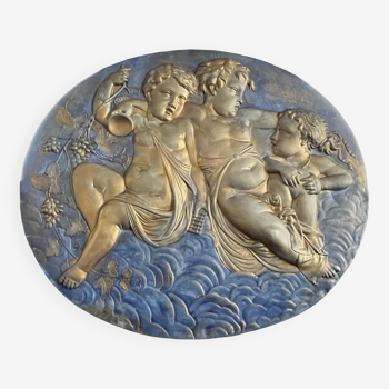 Old large plaster medallion decorated with 20th century putti