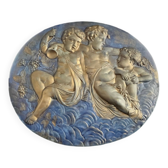 Old large plaster medallion decorated with 20th century putti