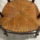 Provencal style straw armchair sometimes called marsh armchair