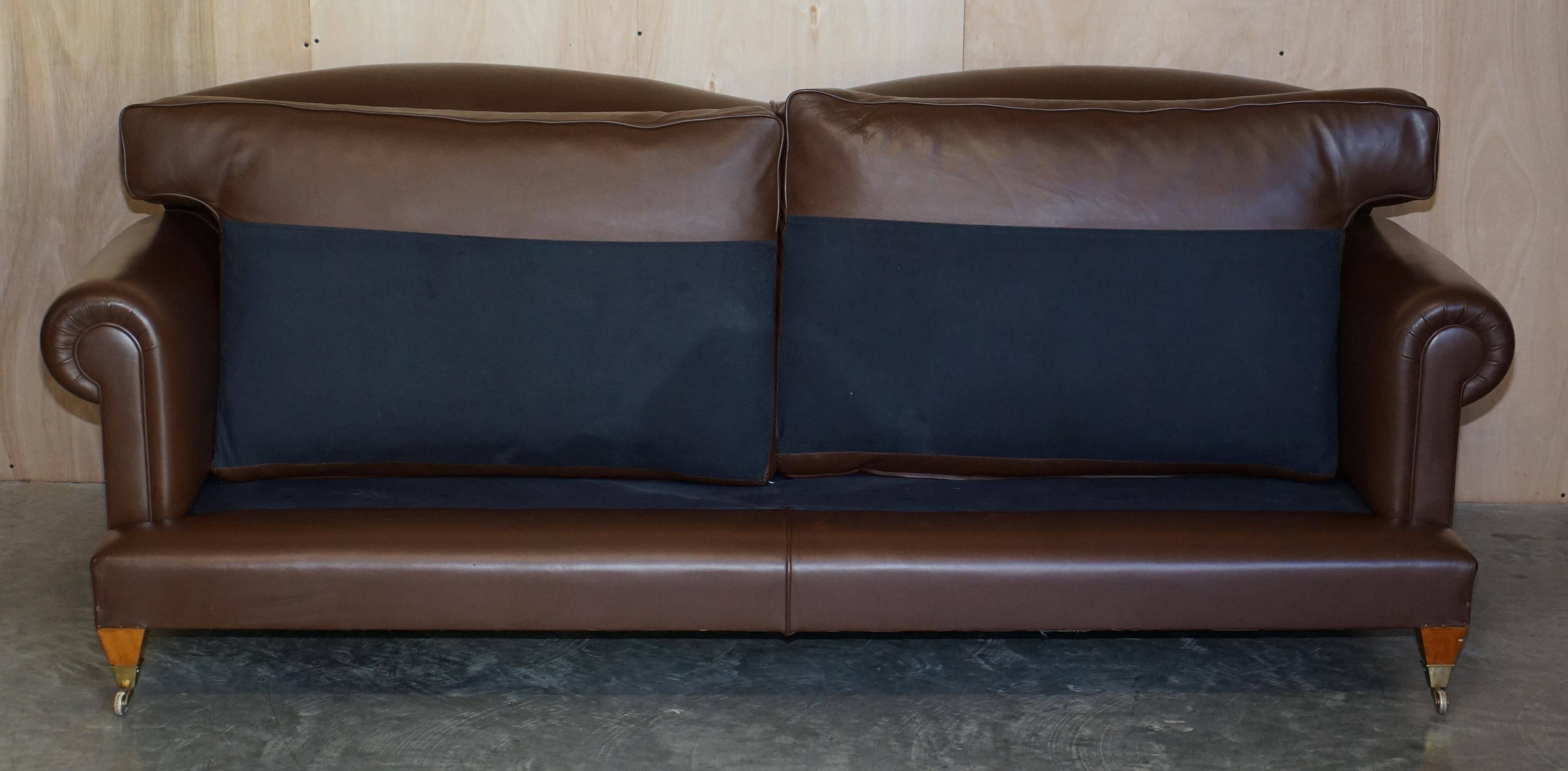 Contemporary Howard & Sons style grand sofa with brass casters.