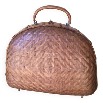 Half-moon wicker suitcase