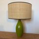 Vintage green glazed ceramic lamp and cane shade