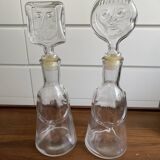 Pair of decanters by Erik Hoglund for Neiman Marcus, "People" series, Kosta Boda