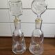 Pair of decanters by Erik Hoglund for Neiman Marcus, "People" series, Kosta Boda