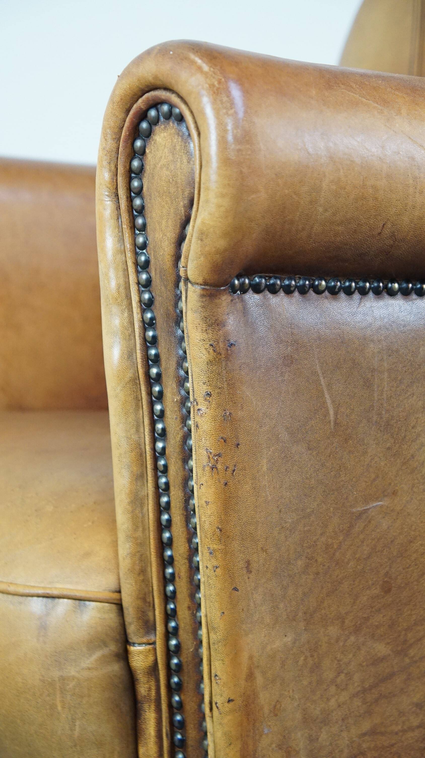 Stately, sleekly finished, comfortable sheepskin armchair