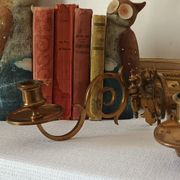 Pair of antique wall-mounted brass candle holders