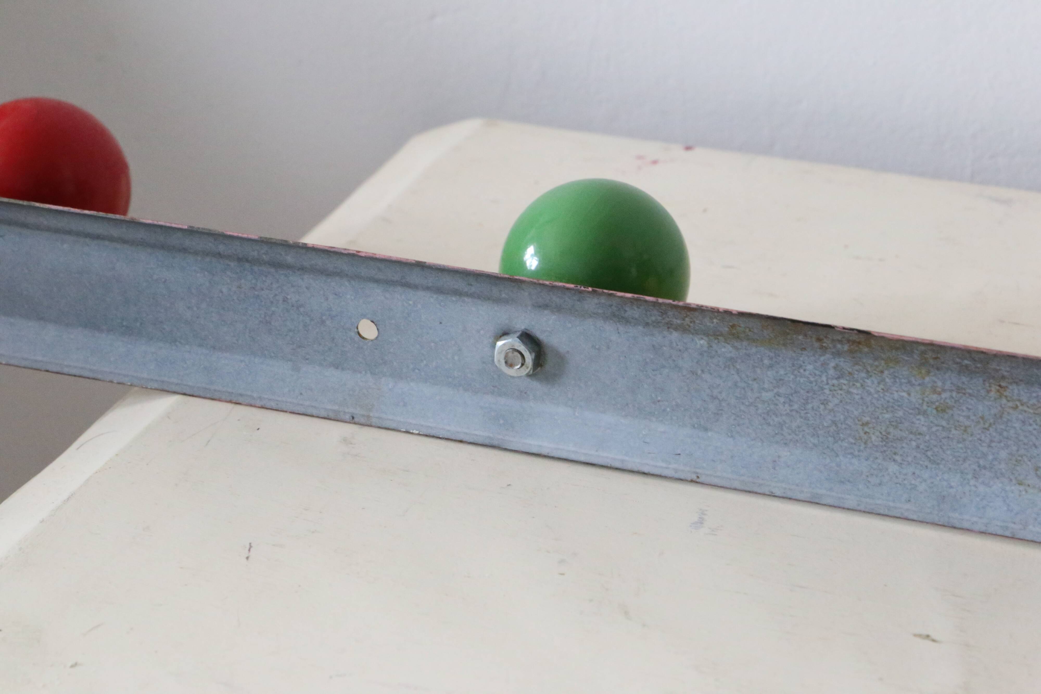 Wall-mounted coat rack, metal and colored wooden hook, 1960
