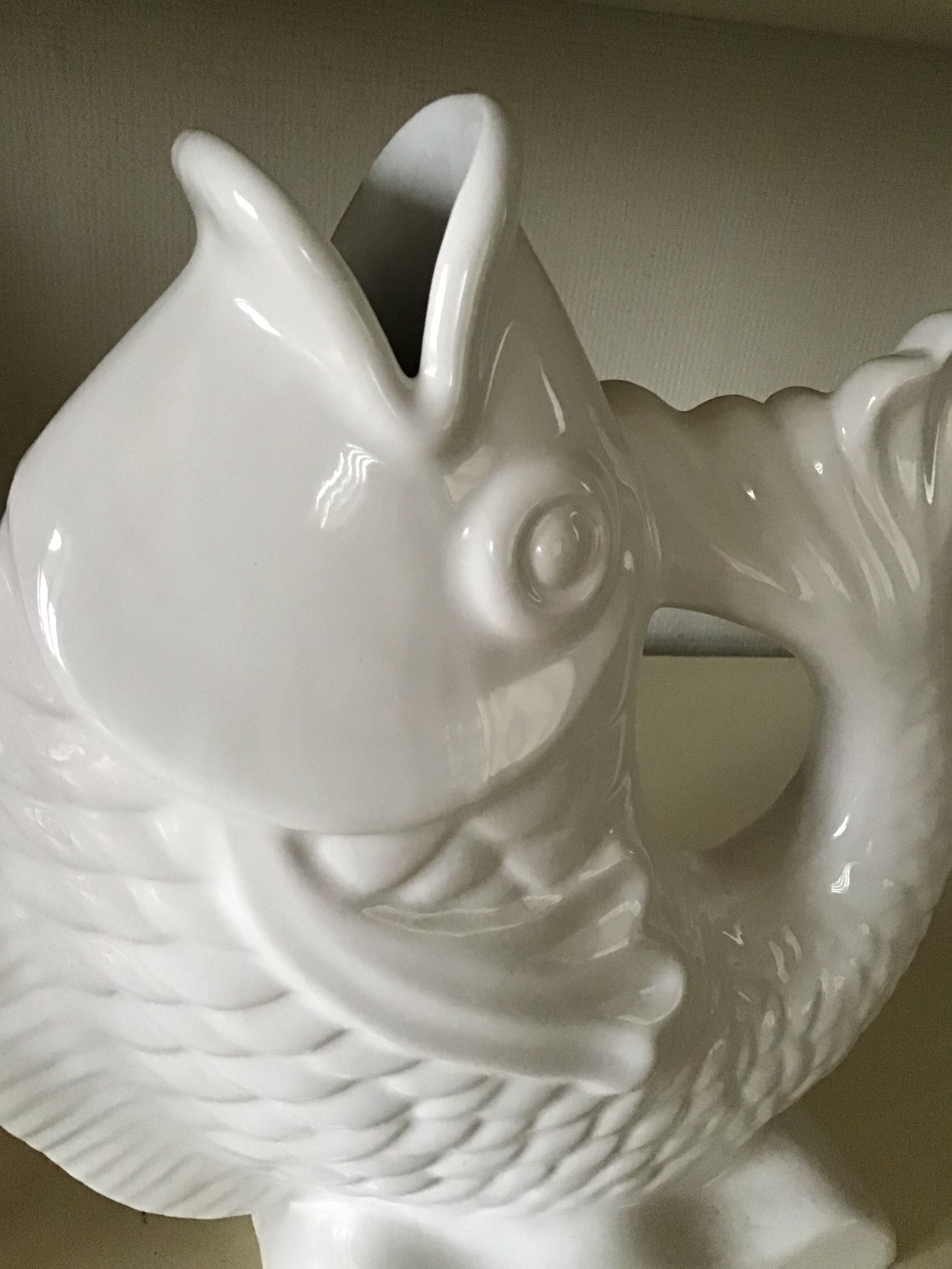 White ceramic vase in the shape of fish