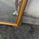 Large antique gilded mirror with carved pediment, 126 cm