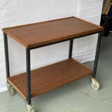 Vintage wooden and metal serving trolley on wheels with double tray