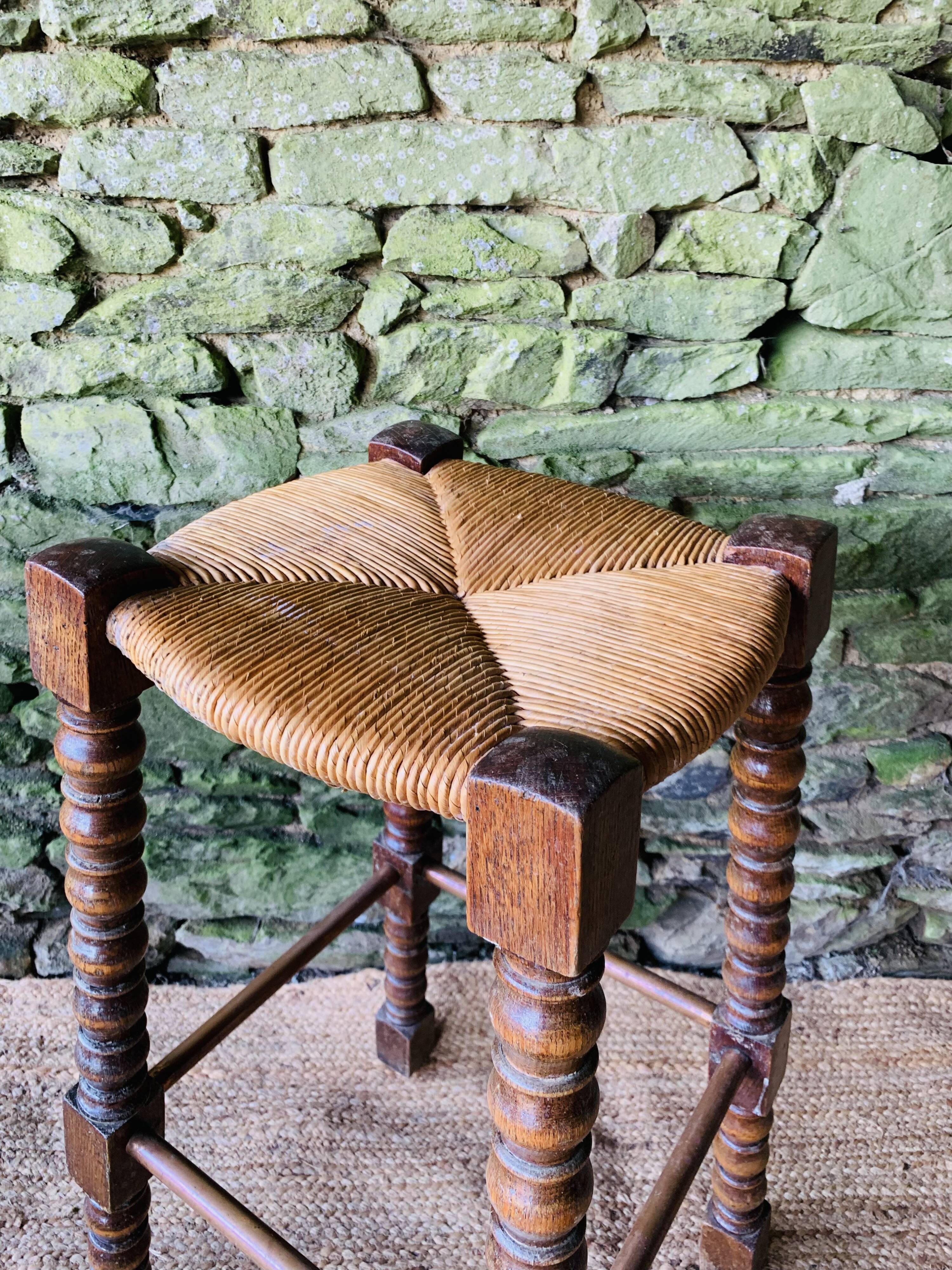 High stool in turned wood