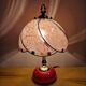 Vintage pink glass globe lamp with brass details and pink base