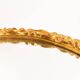 Vintage oval decorative mirror in gilded wood with floral frame, Italy, 1960s.