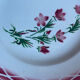 Flat plates Aude Sarreguemines with a rose flower design.