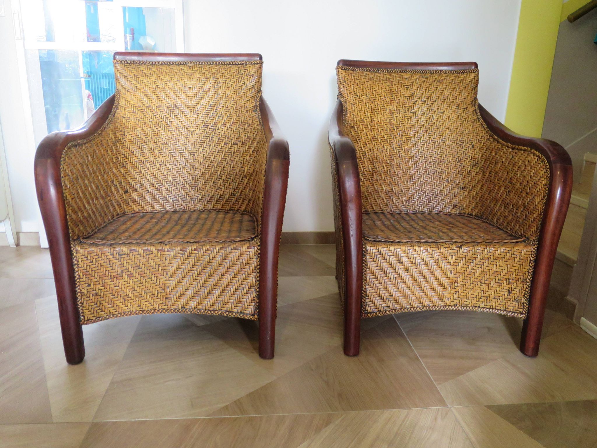 Set of 2 armchairs in woven rattan and exotic wood, 1980s