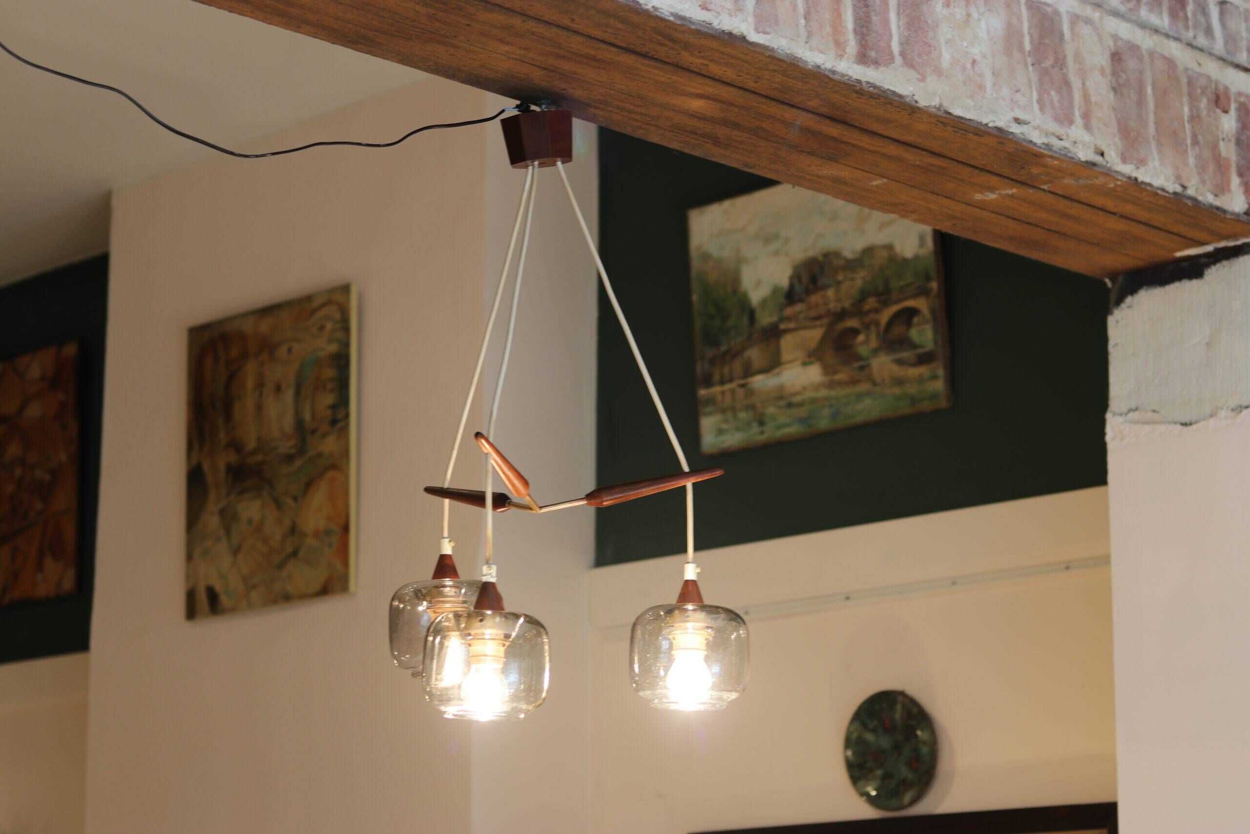 Scandinavian chandelier "Cascade" from the 1960s in brass, teak, and smoked glass.