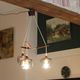 Scandinavian chandelier "Cascade" from the 1960s in brass, teak, and smoked glass.