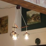 Scandinavian chandelier "Cascade" from the 1960s in brass, teak, and smoked glass.