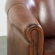 Vintage sheepskin club armchair in English style with deep colours