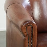 Vintage sheepskin club armchair in English style with deep colours