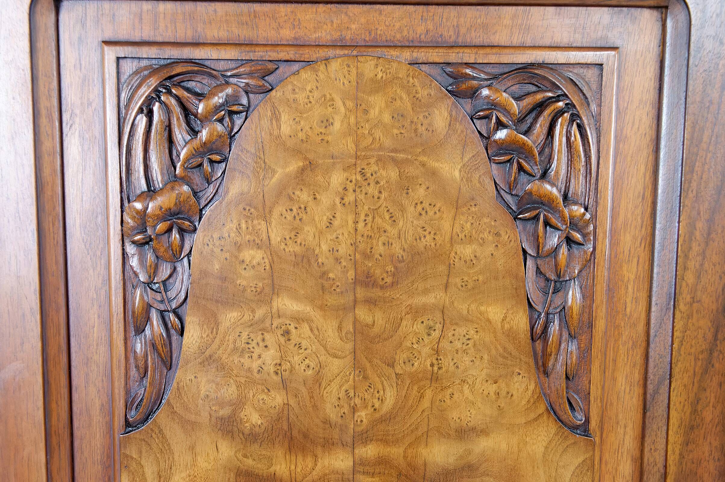 Art Deco showcase bookcase in carved walnut, France, circa 1925