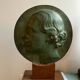 Patinated plaster profile medallion sculpture