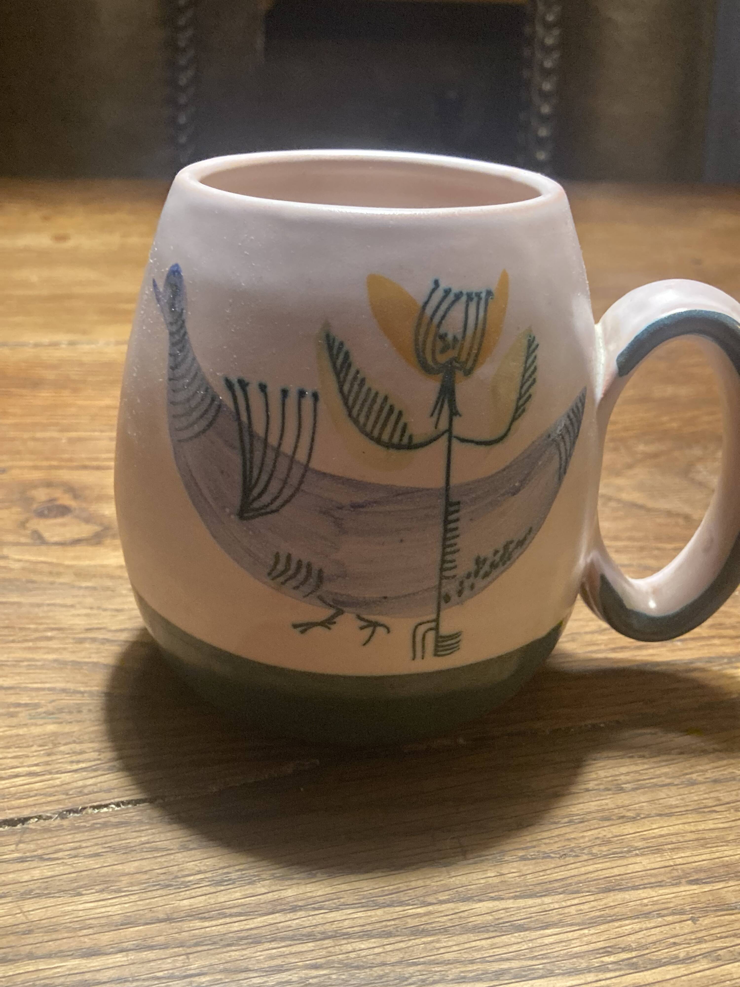 Set of two ceramic mugs signed Yvon ROY